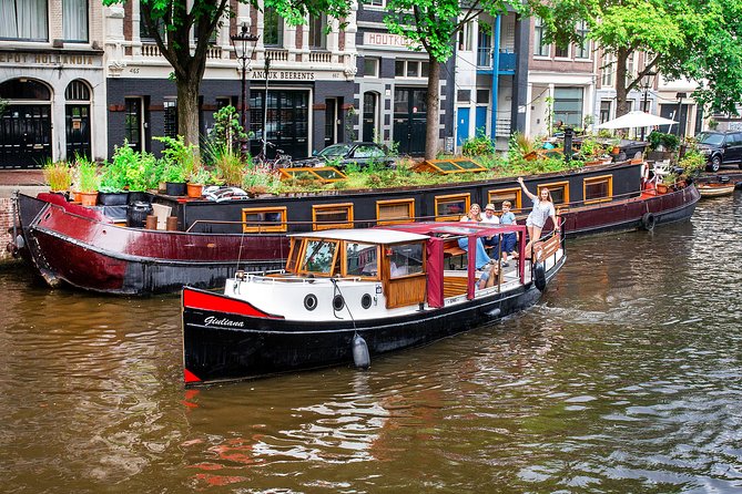 Amsterdam Small-Group Canal Cruise With Dutch Snacks and Drink - The zoo, LGBTQ monument, and smaller waterways