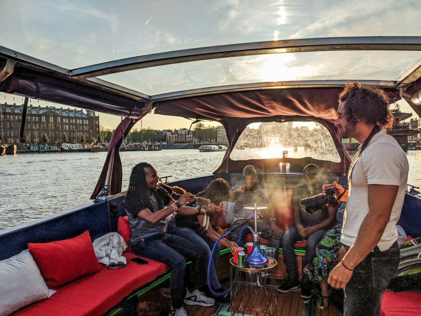 Amsterdam: Smoke and Lounge City Boat Cruise - Leaving Central Station for the canal belt