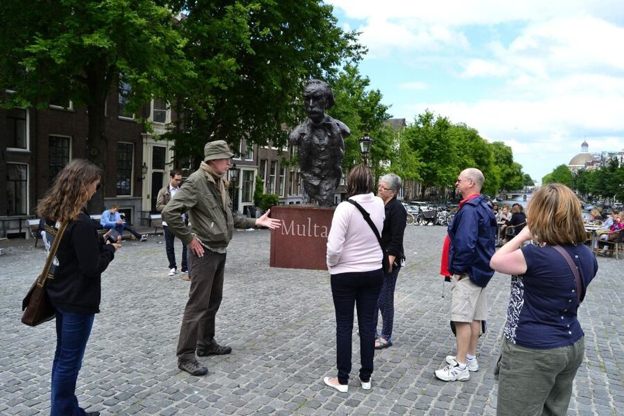 Amsterdam: The Story of History & Culture Walking Tour - Following Amsterdam’s older canals and buildings