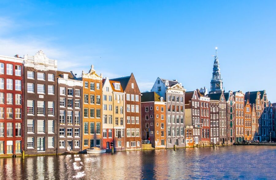 Amsterdam Walking Tour and Canal Cruise - A street market adds ordinary Amsterdam to the day