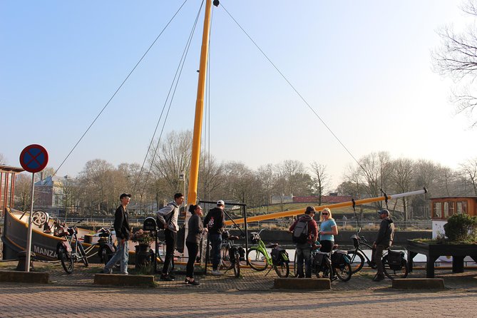 E-Bike Tour, Amsterdam's Highlights and Hidden Gems - Riding beneath the Rijksmuseum and across Museumplein