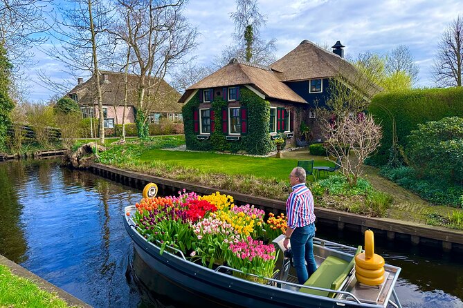 From Amsterdam: Giethoorn Day Trip with Canal & Village Tour - A windmill stop with more than a photo