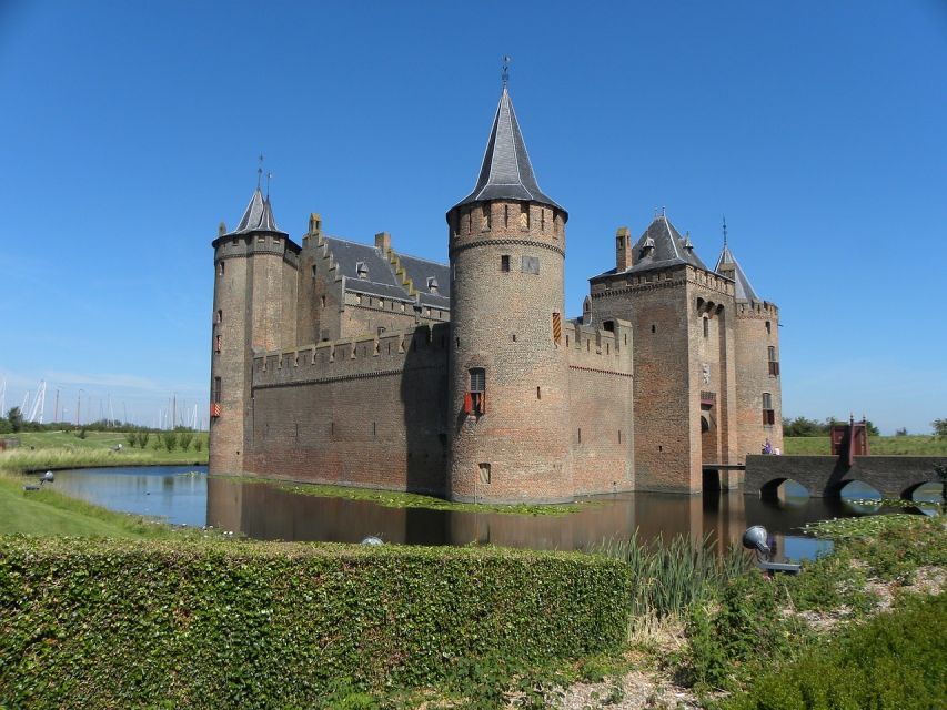 From Amsterdam: Private Day Trip to the Dutch Castles - Entering Muiden Castle by drawbridge