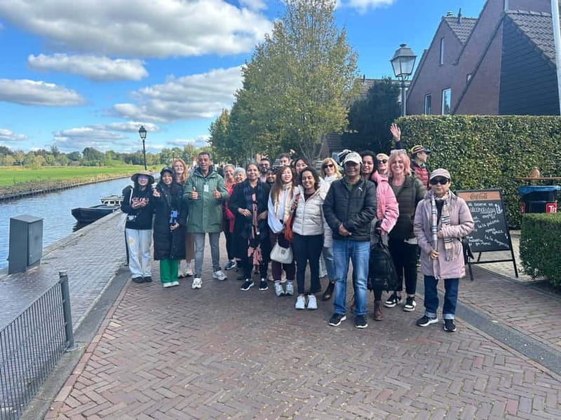 From Amsterdam to Giethoorn Day Trip - Meeting under the white umbrella in central Amsterdam