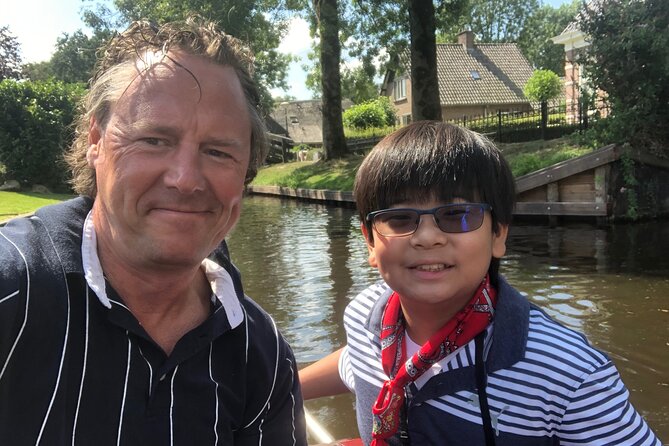 Giethoorn, Private Boat Tour & Zaanse Schans Windmills - Giethoorn by punter, footpath, and canal