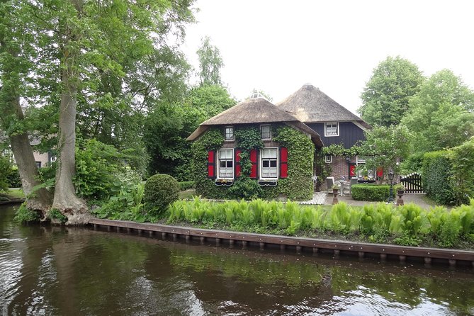 Giethoorn, Zaandam & Zaanse Schans Day Tour w/ Small Boat Ride - The long road beside IJsselmeer