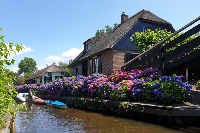 Giethoorn, Zaandam & Zaanse Schans Day Tour w/ Small Boat Ride - Seeing a wooden clog take shape