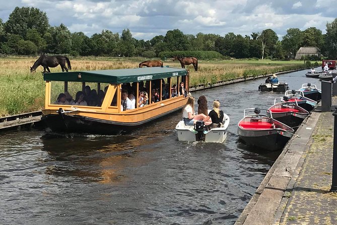 Giethoorn, Zaanse Schans Windmills Guided Day Trip from Amsterdam - What the guide can add to a fixed itinerary