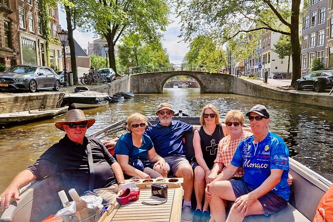 Private 90 Minute Amsterdam Canal Belt Exploration Cruise - Munt Tower and the floating flower market