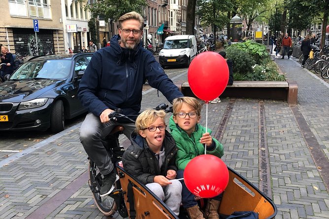 Private Amsterdam Bike Tour with a local guide (also for families) - Cycling beneath the Rijksmuseum
