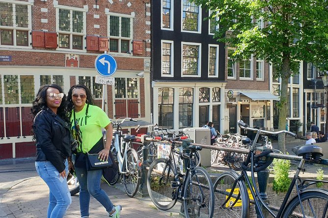 Private Amsterdam Red Light District tour with food tastings - Dam Square and the city built on poles