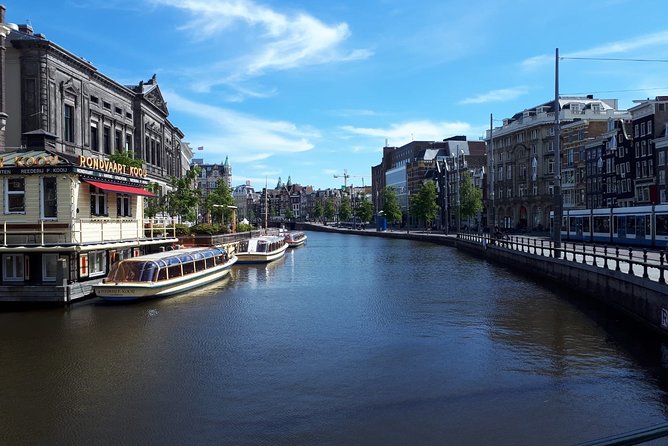 Private Tour: Amsterdam City Walking Tour and Canal Cruise - One hour on the Lovers canal boat