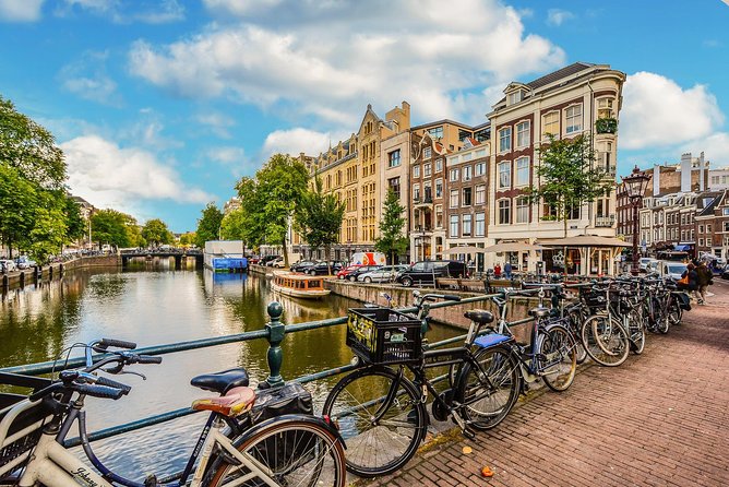 Private Tour: Amsterdam City Walking Tour and Canal Cruise - Dam Square, the Royal Palace, and West Church