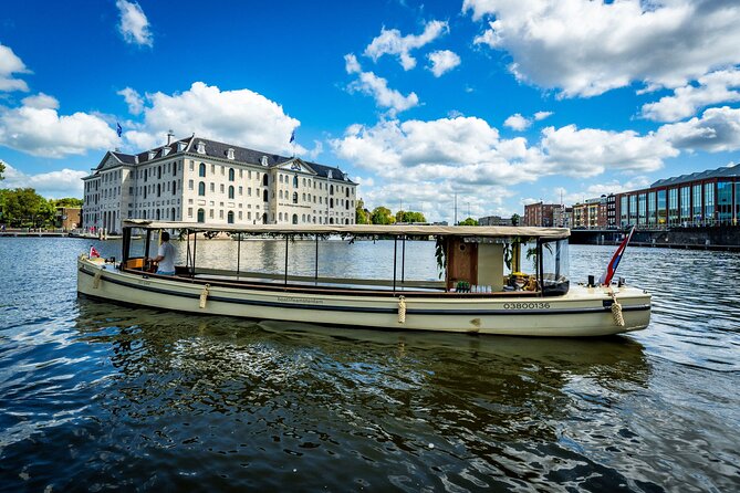 Small-Group Luxury Canal Cruise with Local Skipper - Crossing Amsterdam’s romantic bridge