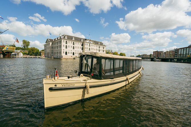 Small-Group Luxury Canal Cruise with Local Skipper - Crooked houses near the Amstel