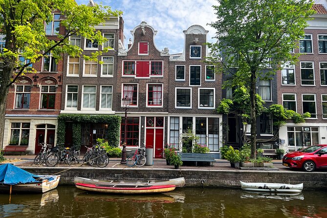 Small Group Walking Tour in Amsterdam with Friendly and Fun Guide - One hour among Amsterdam’s canals