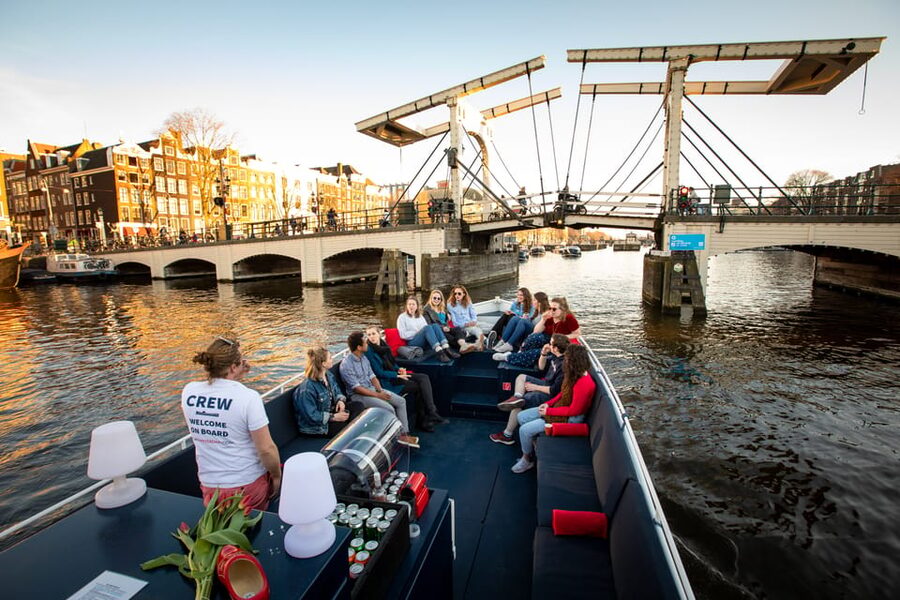 Small-Group Walking Tour with Amsterdam Canal Cruise - Begijnhof offers a quieter center