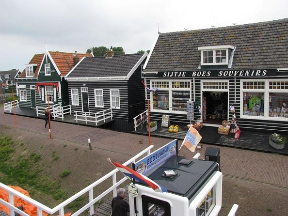 Volendam & Marken Private Tour in luxury Jaguar S Type 1/2 day - Volendam: fish, sweets, and a polished harbor stop